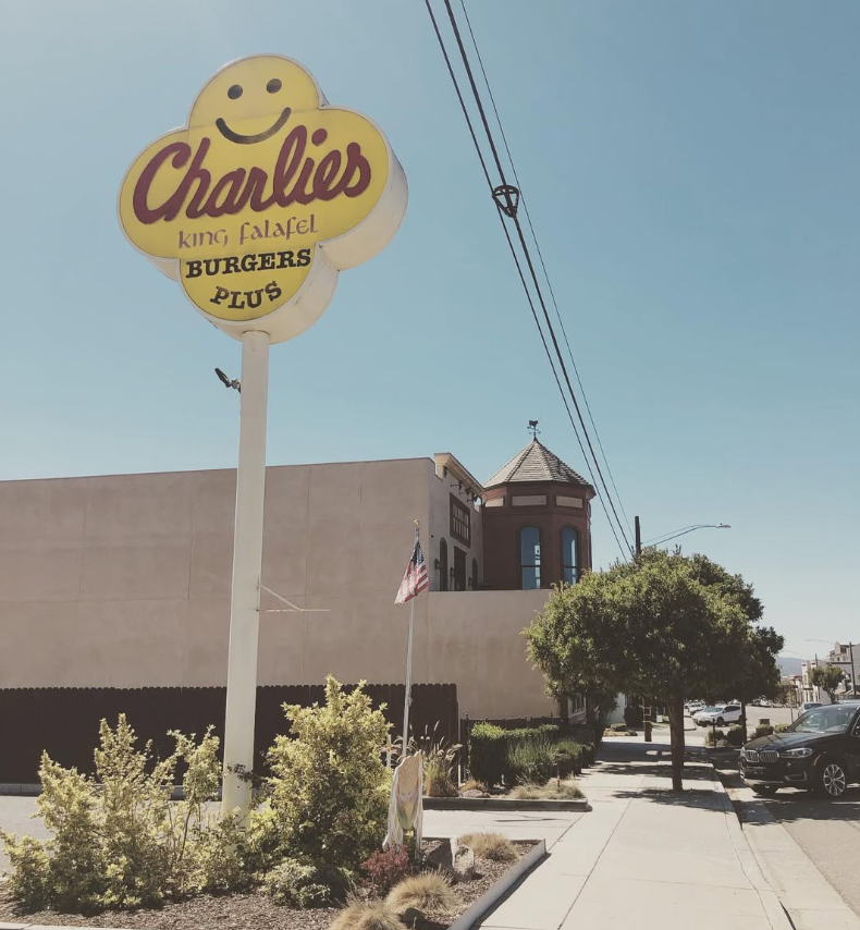 Charlies sign near downtown sidewalk
