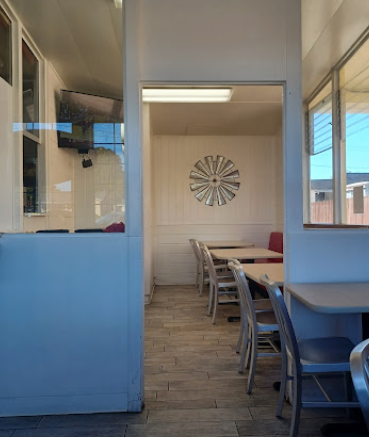 Charlies dining room interior with tables and windmill decor