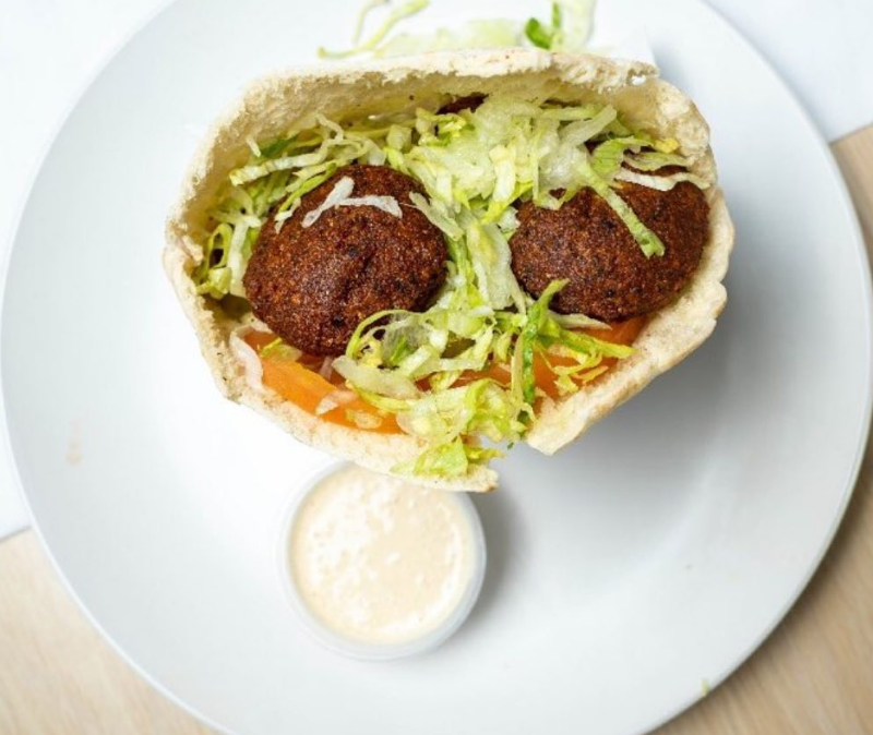 Falafel sandwich in pita with tahini sauce